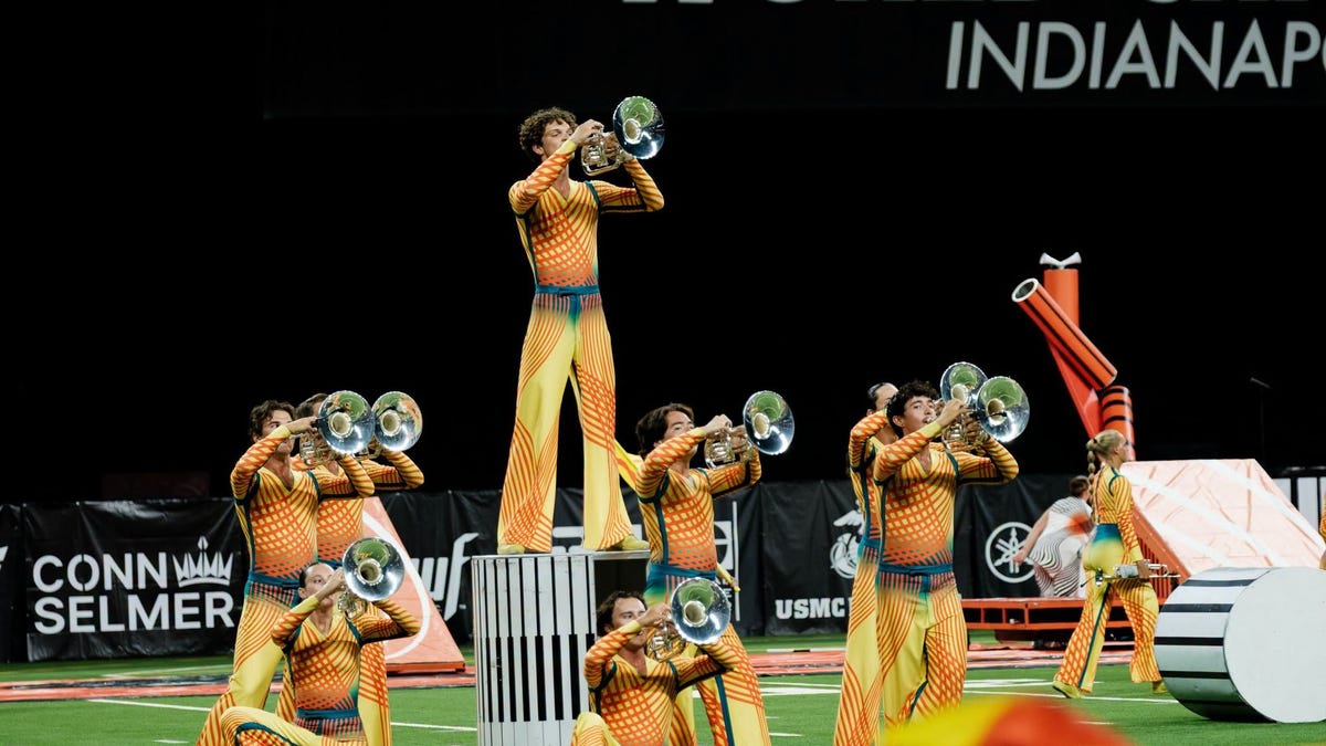 Bluecoats Drum and Bugle Corps performing in blue uniforms at Lucas Oil Stadium championship