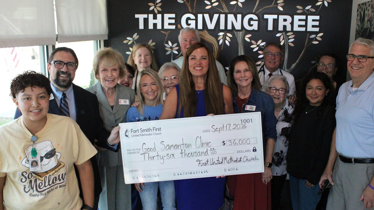Good Samaritan Clinic staff receiving large ceremonial check from First United Methodist Church Foundation representatives