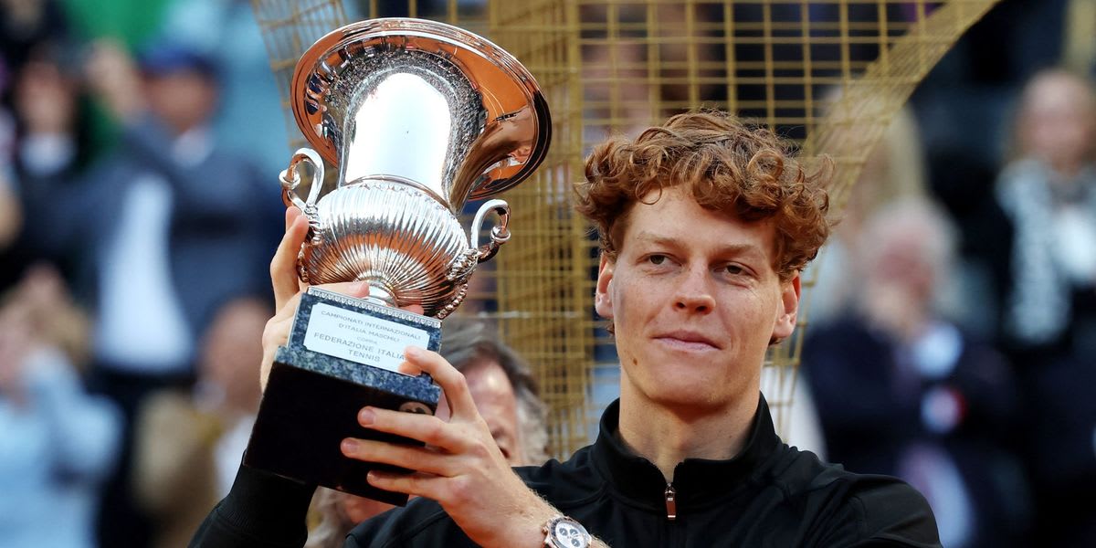 Jannik Sinner celebrates with trophy after winning Italian Open tennis championship in Rome
