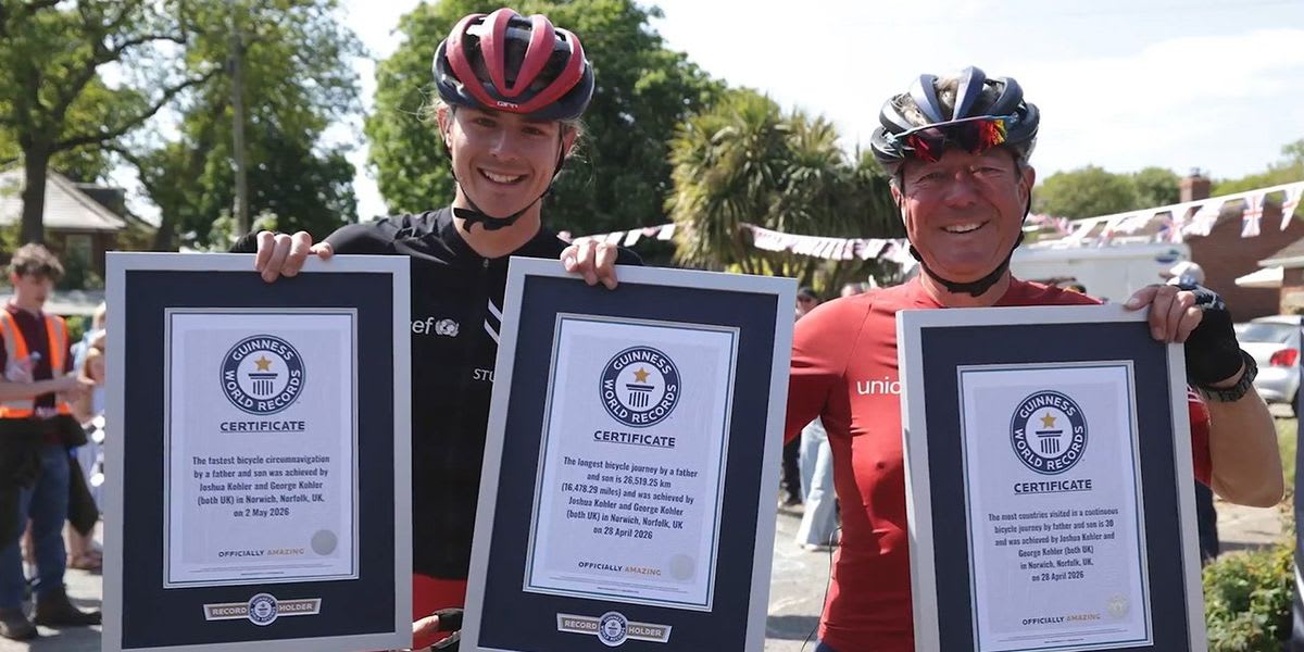 Father and son cyclists George and Joshua Kohler celebrating after completing their world record journey