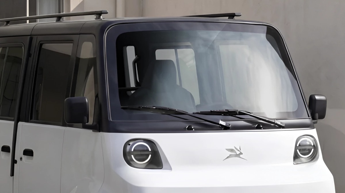 White compact Olinia Uno electric van with distinctive rounded design and small wheels