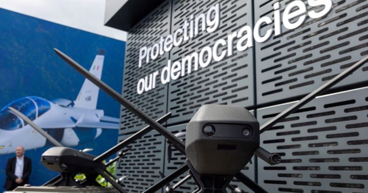 Modern German tech startup office with engineers working on defense innovation and robotics technology