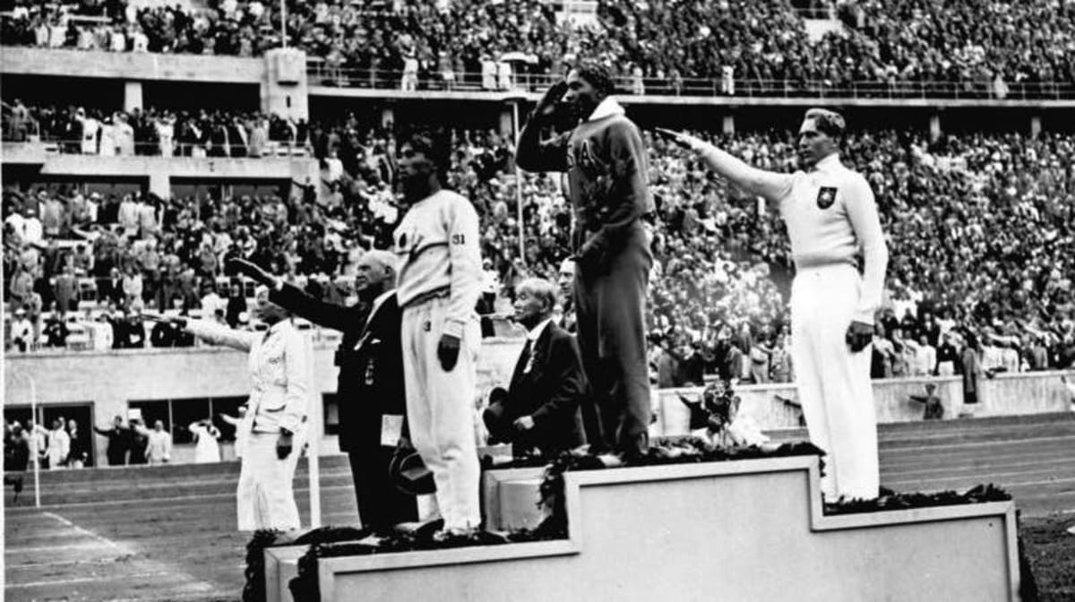** Jesse Owens competing at the 1936 Berlin Olympics during his historic four gold medal performance