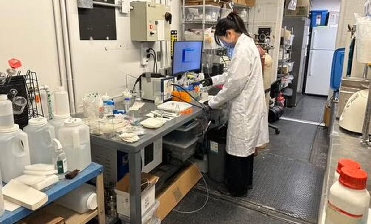 Plastic waste transforming into acetic acid molecules under sunlight in laboratory setting