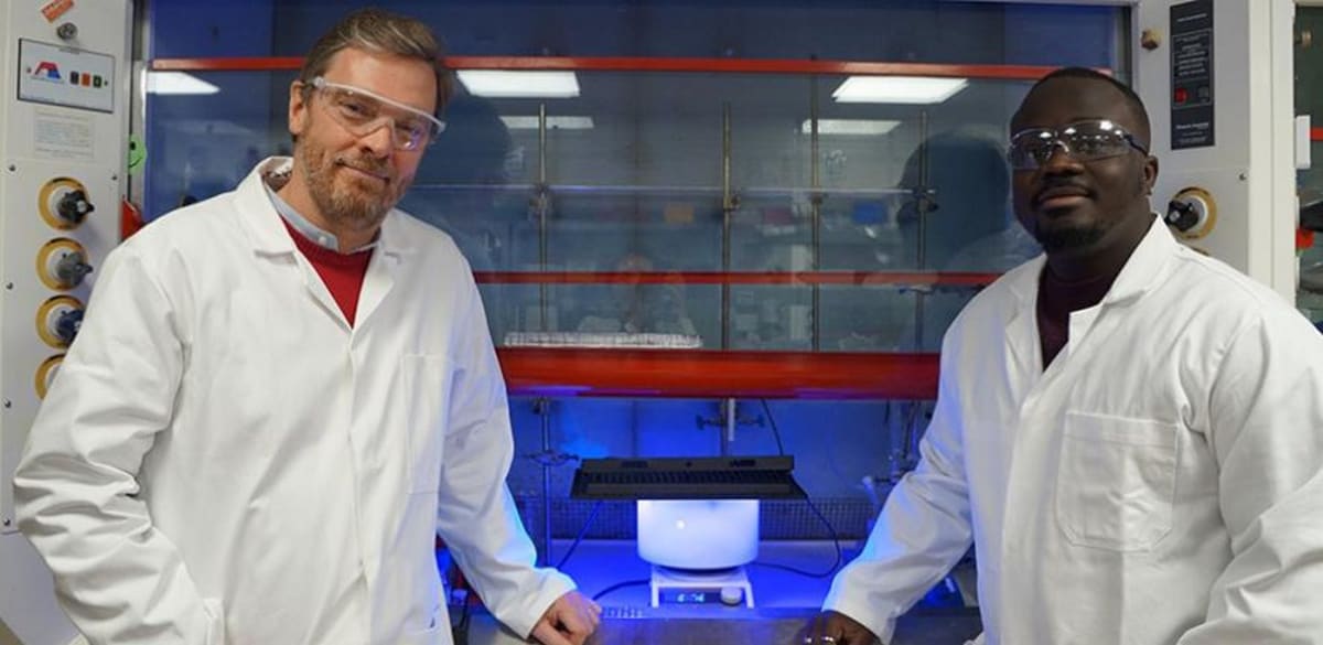 Professor Reisner and researcher Kay Kwarteng with solar-powered plastic recycling reactor at Cambridge University