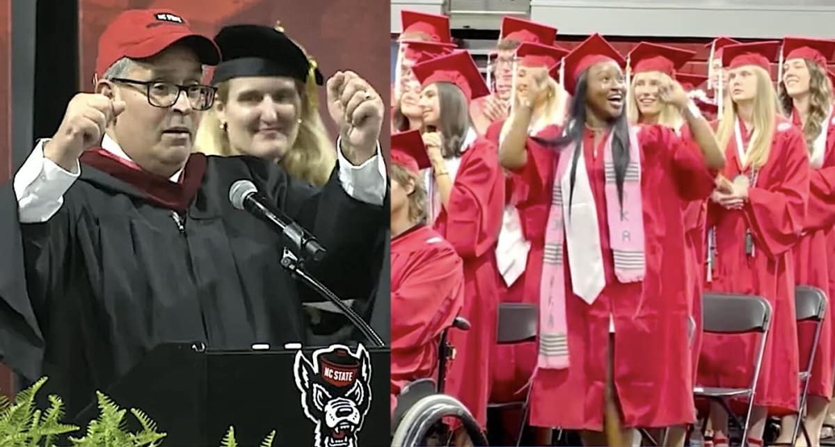 Graduates in red caps and gowns celebrate at North Carolina State University commencement ceremony