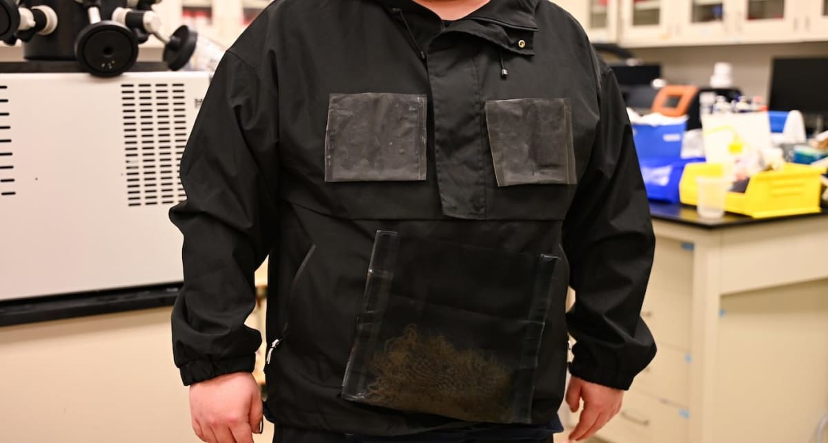 High-tech jacket with detachable water harvesting units laid out on foldable collector piece