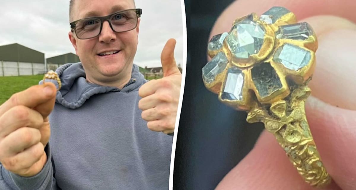 Stuart Jones holding rare 16th century gold ring with eight diamonds cluster design