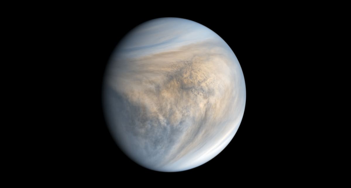 Venus glowing bright in ultraviolet light against the darkness of space