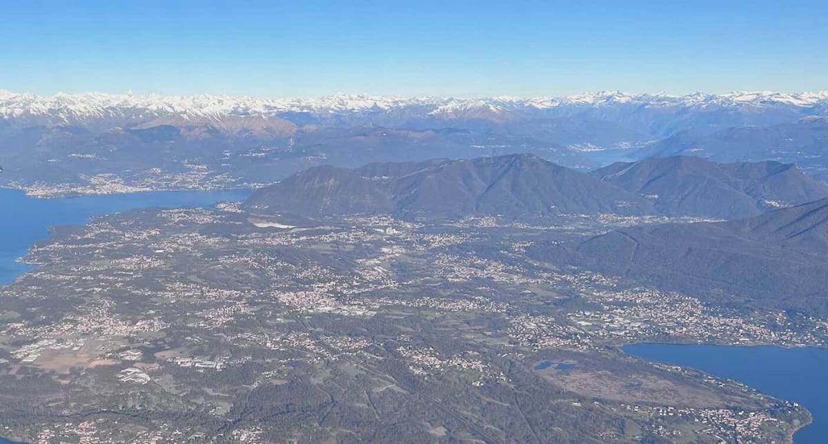 Scenic view of Lago Maggiore with clear skies and Italian Swiss Alps in background