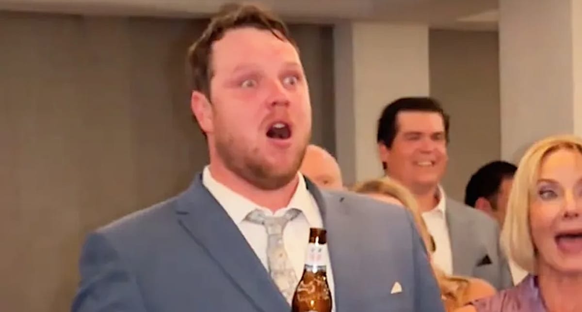 Bride Jordan crying tears of joy during father-daughter dance at wedding reception