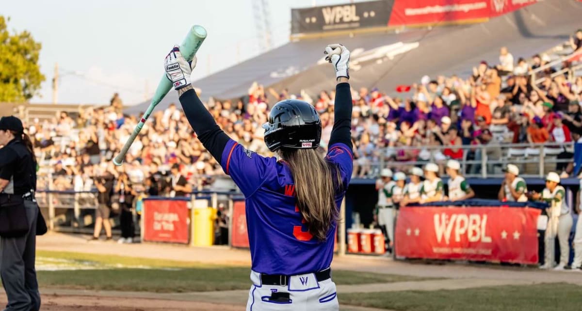 Maybelle Blair in wheelchair throwing ceremonial first pitch at Women's Professional Baseball League opening game