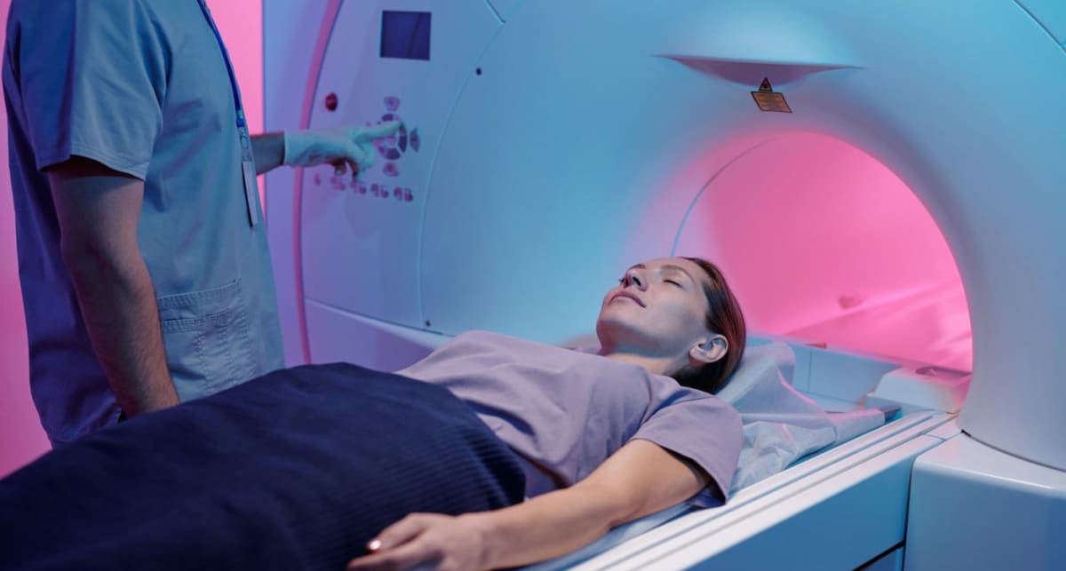 Child patient preparing for radiation-free lung MRI scan with specialized xenon gas equipment