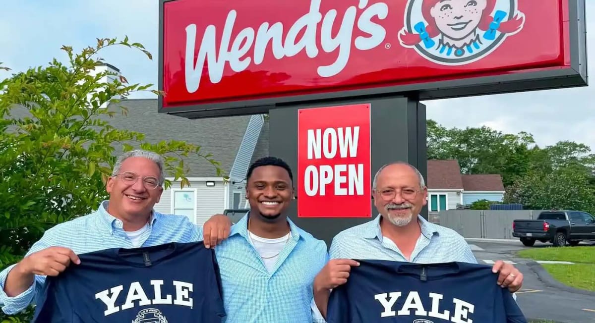 Thalles DeSouza smiling in Wendy's uniform at Cape Cod restaurant location