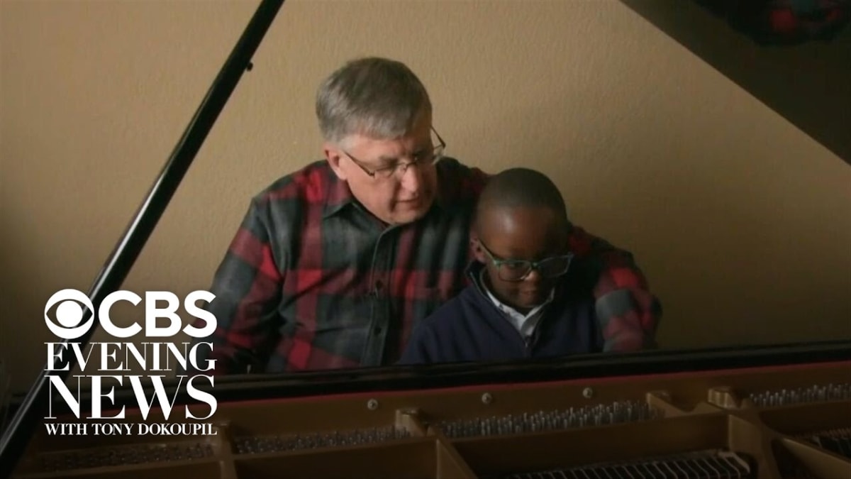 Young autistic pianist Jude Kofie playing grand piano gifted by stranger Bill Magnuson
