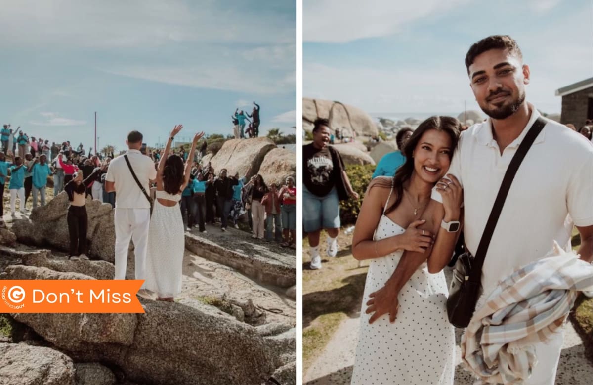 Newly engaged couple surrounded by celebrating strangers on Cape Town beach at sunset