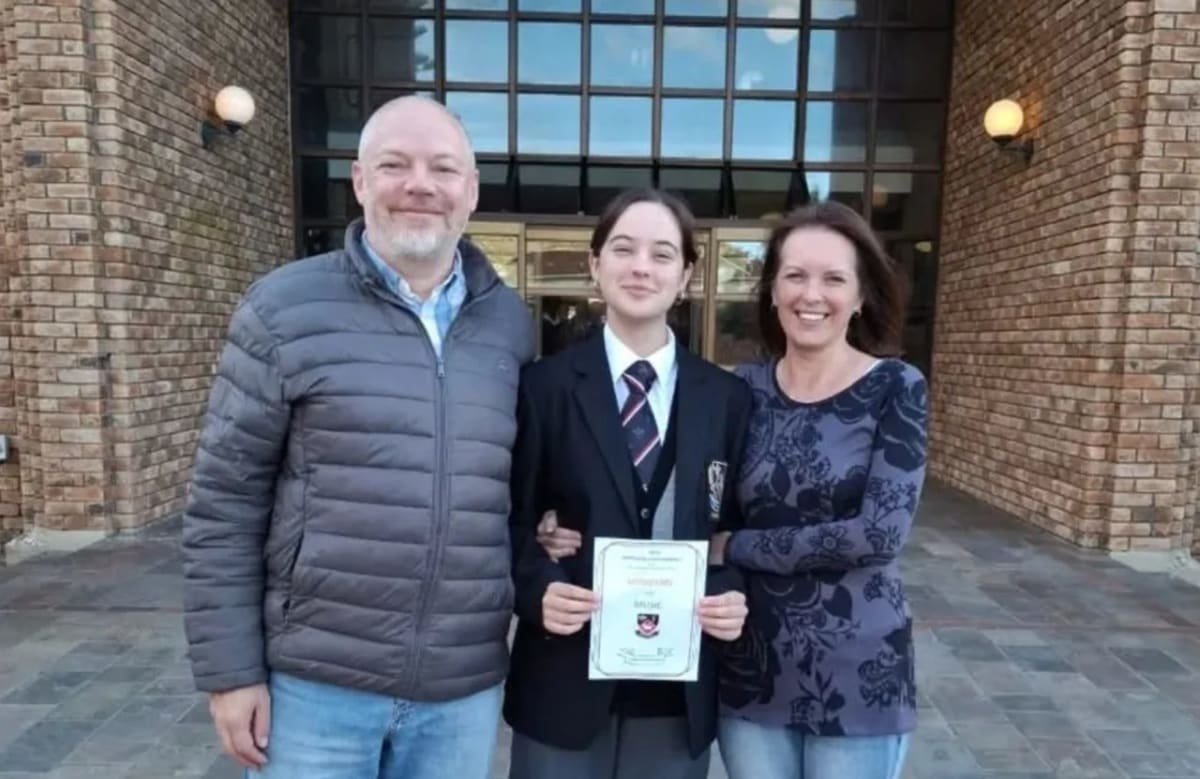 Young female cellist Evangeline Wilson-Harris wearing prestigious black blazer at Fish Hoek High School