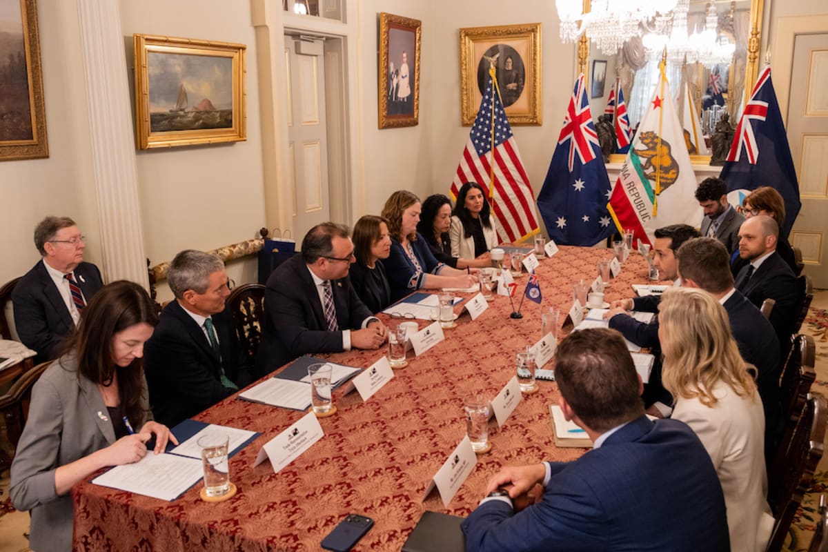 California and Queensland officials shake hands after signing agricultural innovation partnership agreement