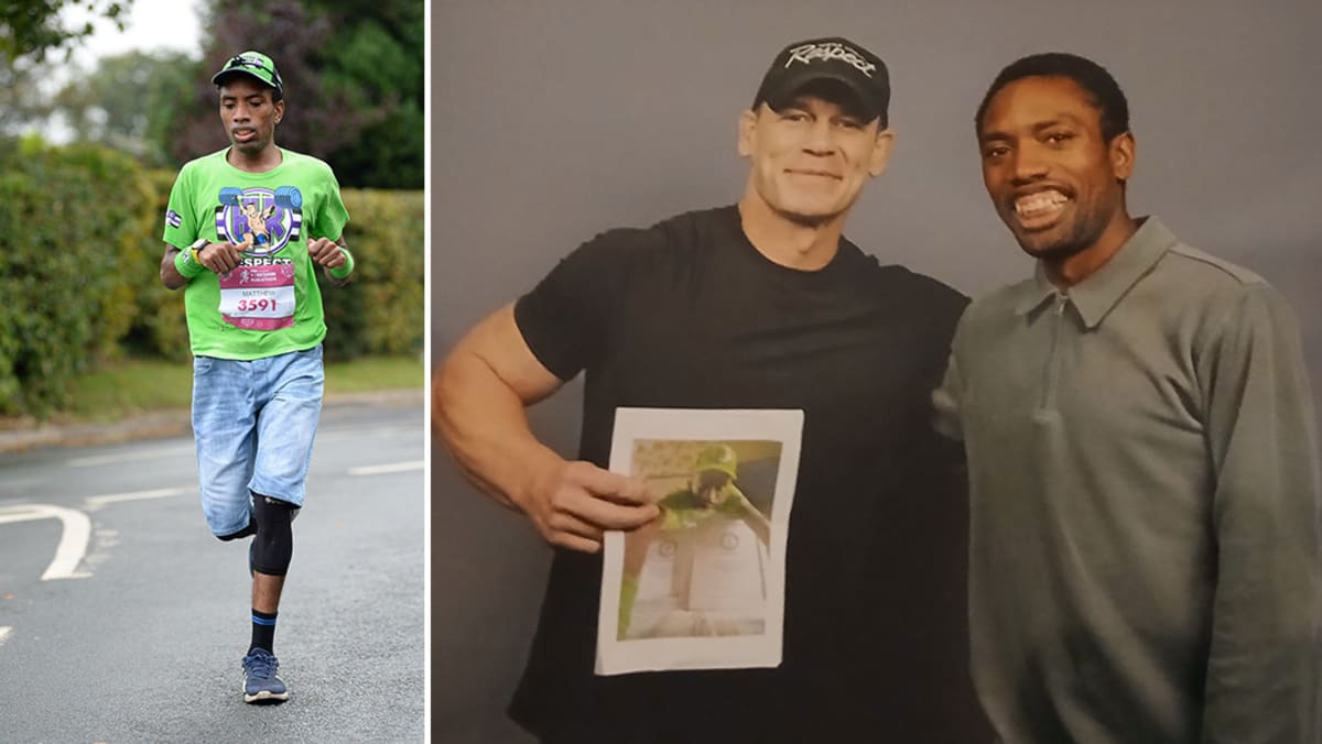 Matthew Akpan in green John Cena shirt and jean shorts meeting wrestler at convention