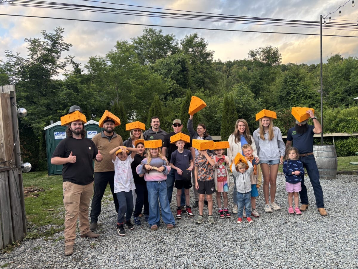 Fundraiser teams gather with children at Appalachian Mountain Brewery celebration in Boone, North Carolina