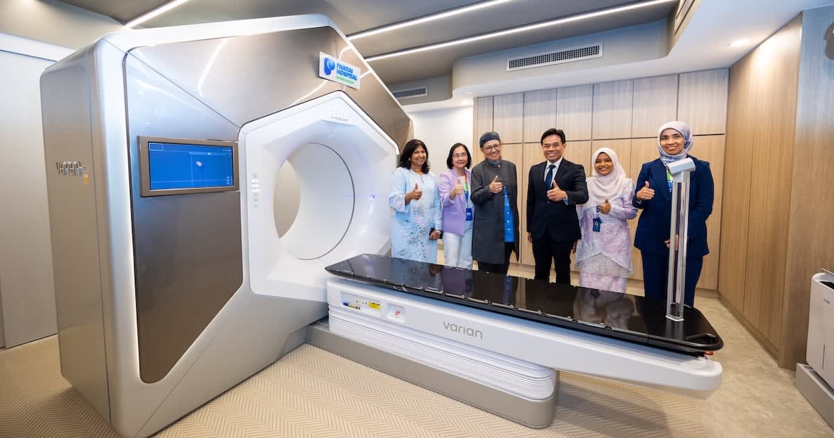 Medical professional operating advanced AI-powered radiotherapy system at cancer treatment center in Malaysia