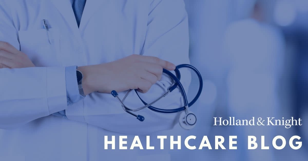 Doctor conducting video telehealth appointment with patient on computer screen showing compassionate care