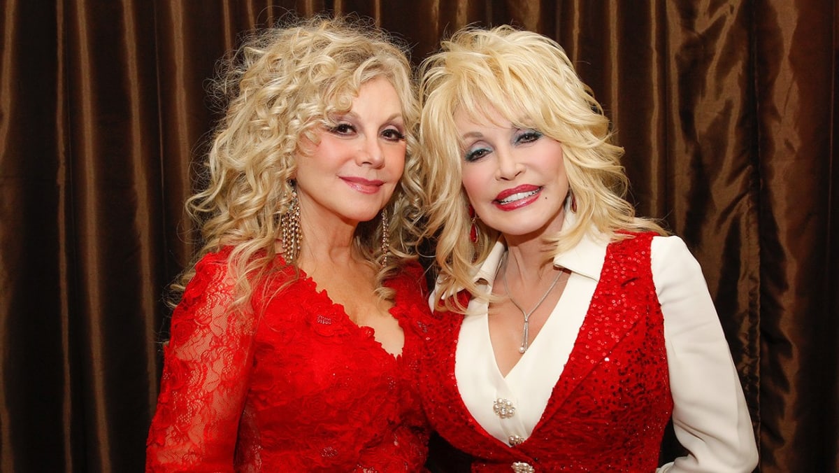 Dolly Parton and sister Stella Parton smiling together at public event