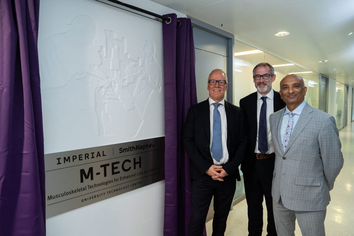 ** Robotic surgical equipment in modern hospital operating room with advanced technology displays
