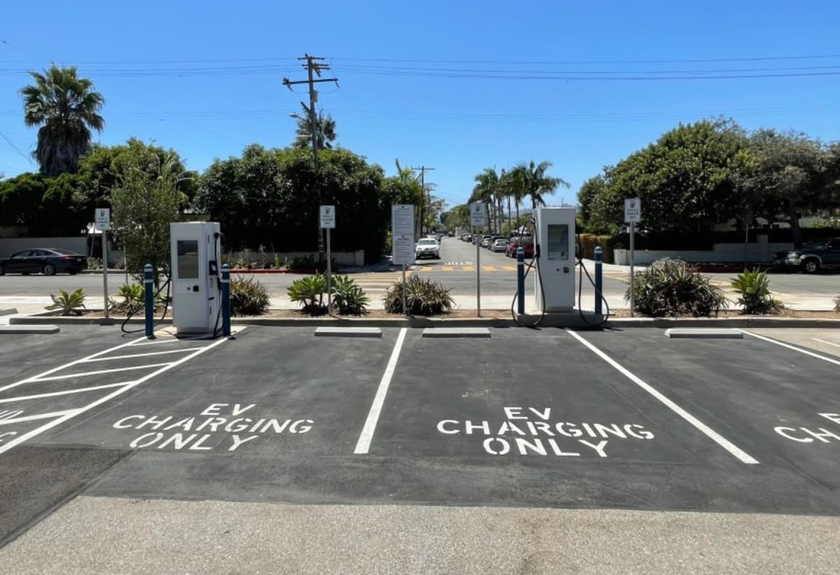Modern electric vehicle charging stations outside public library building in Santa Barbara California
