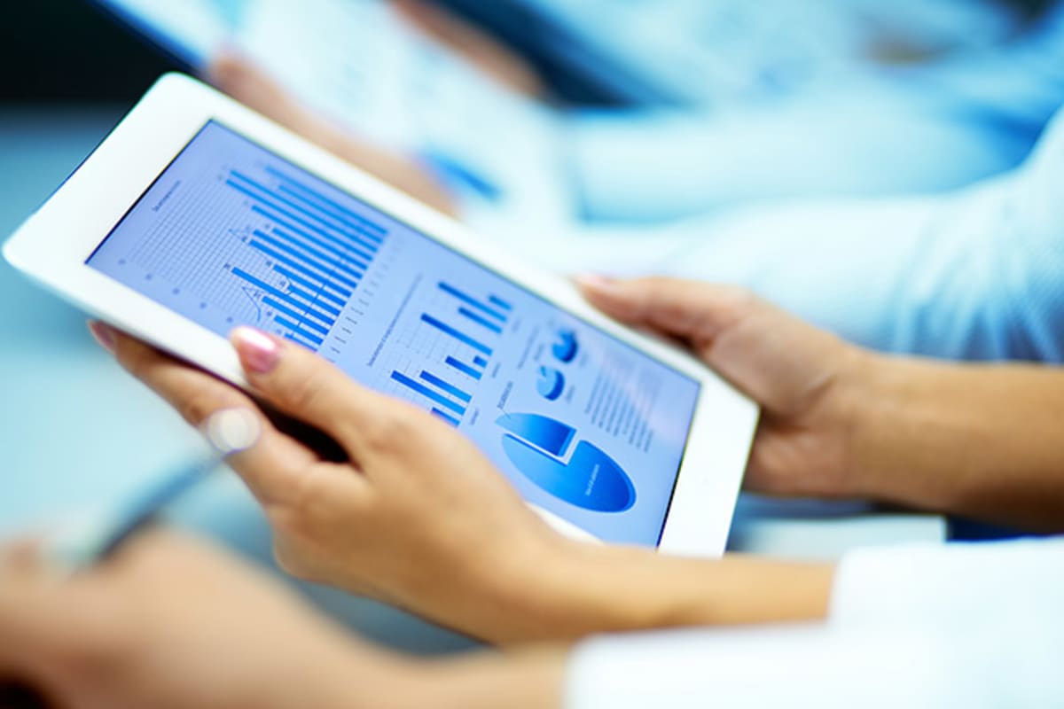 California coastline with reusable containers and recycling symbols representing the state's plastic reduction initiative