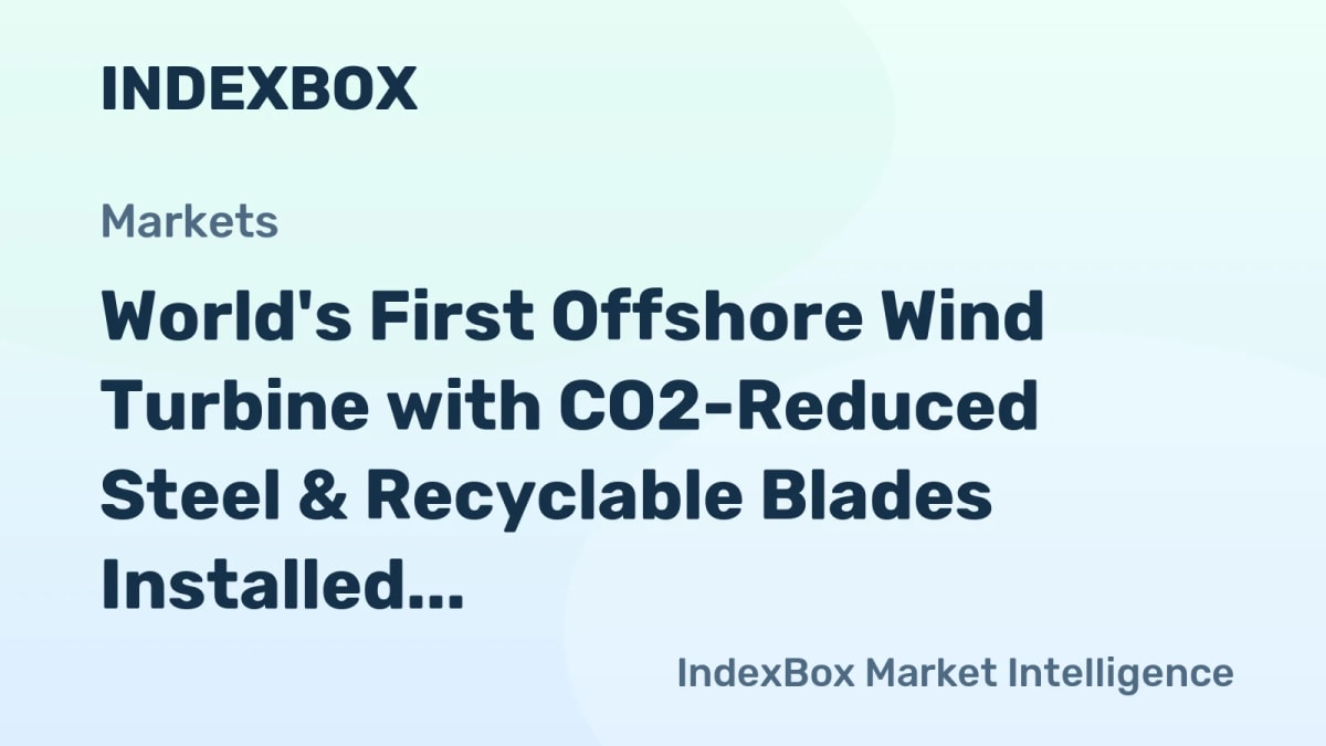 Large white offshore wind turbine being installed in ocean waters off Denmark coast