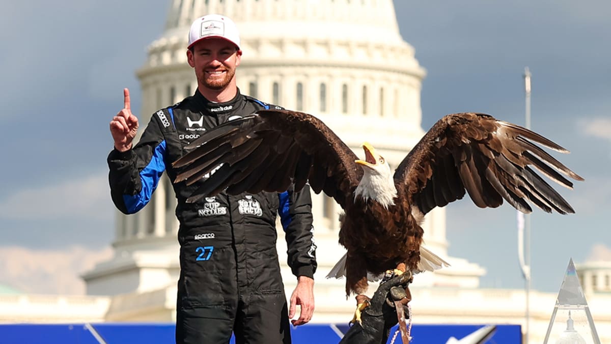 Kyle Kirkwood celebrates in his race car after winning historic Washington D.C. race