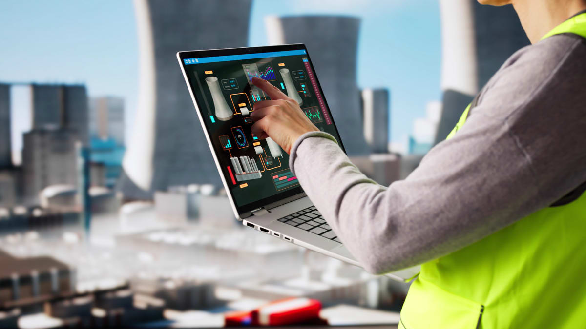 Modern nuclear power plant cooling towers against blue sky in Sweden
