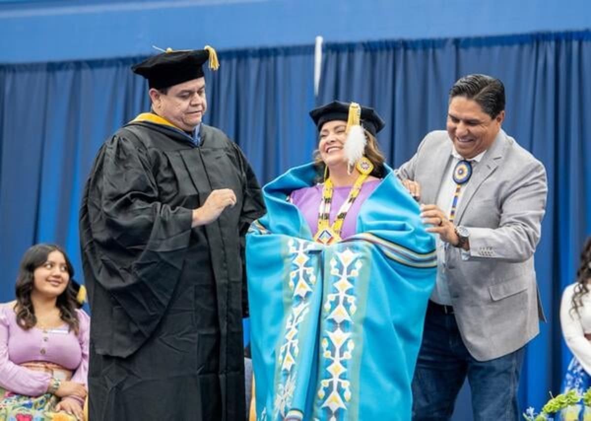 Heather J. Shotton stands at podium during presidential investiture ceremony at Fort Lewis College