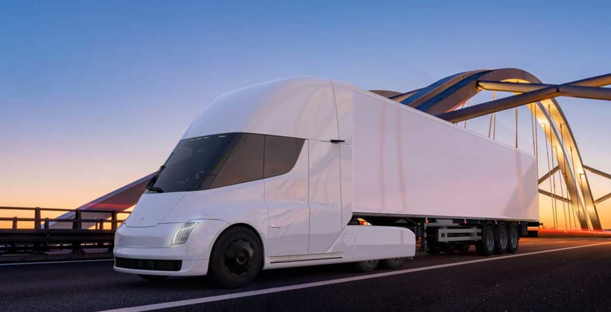 White Tesla Semi electric truck on highway representing clean freight transportation future