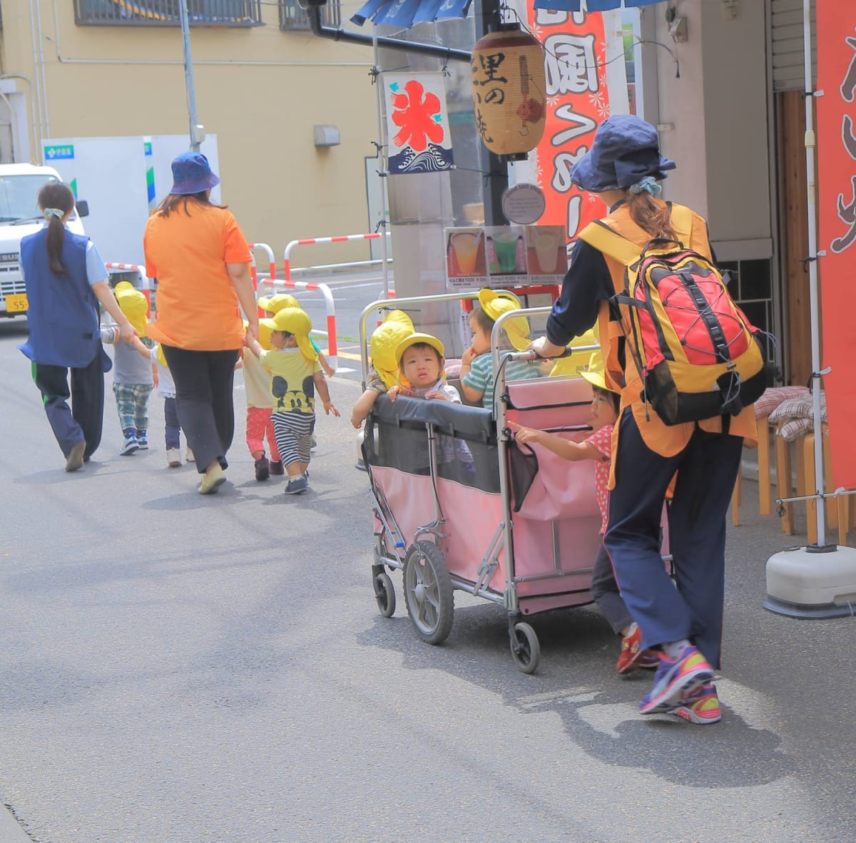 Japanese children playing together in a bright, welcoming nursery school classroom