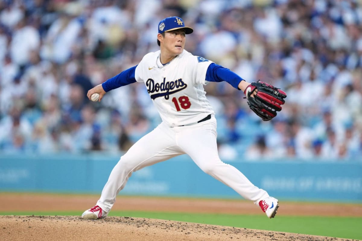 Japanese baseball pitcher Yoshinobu Yamamoto in focused throwing stance during practice session
