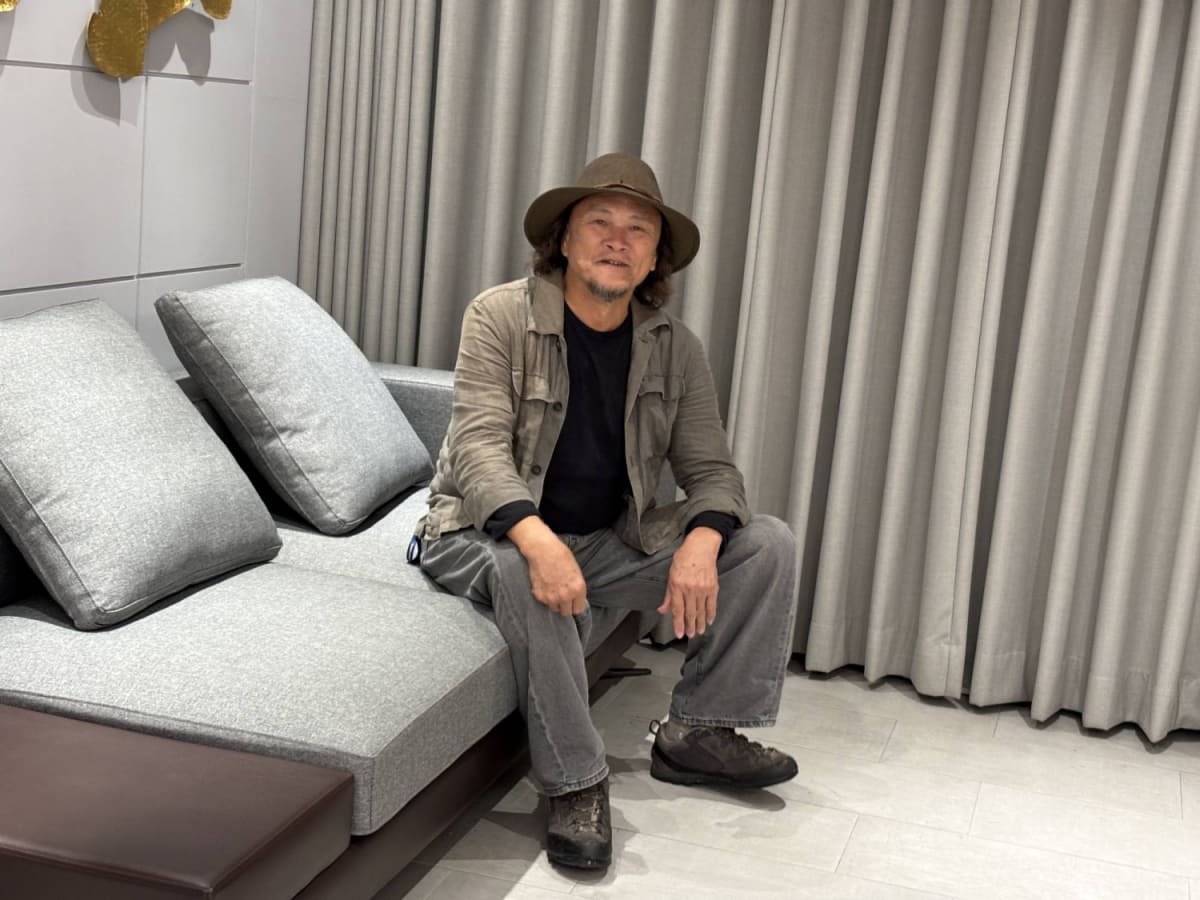 Large dome-shaped bamboo installation resembling traditional Taiwanese farmer's hat with sunlight filtering through framework
