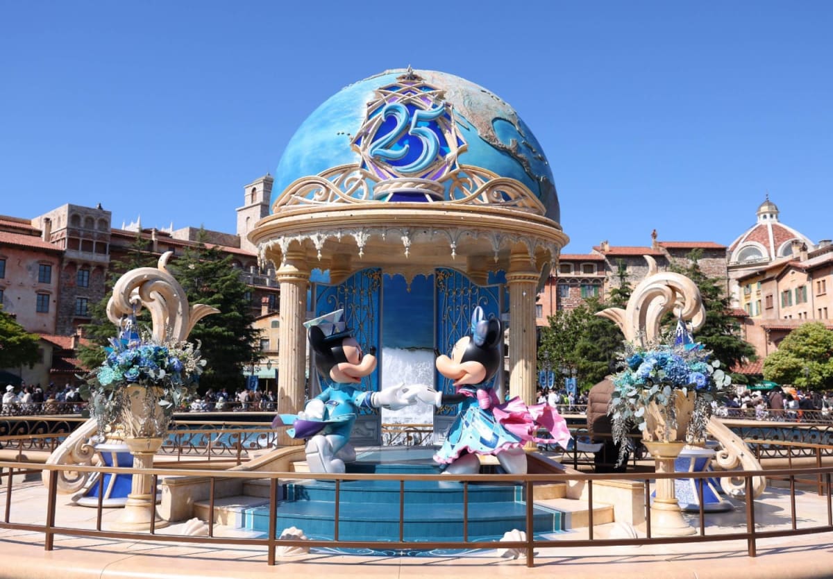 Tokyo DisneySea theme park decorated with ocean-blue anniversary celebration banners and festive decorations