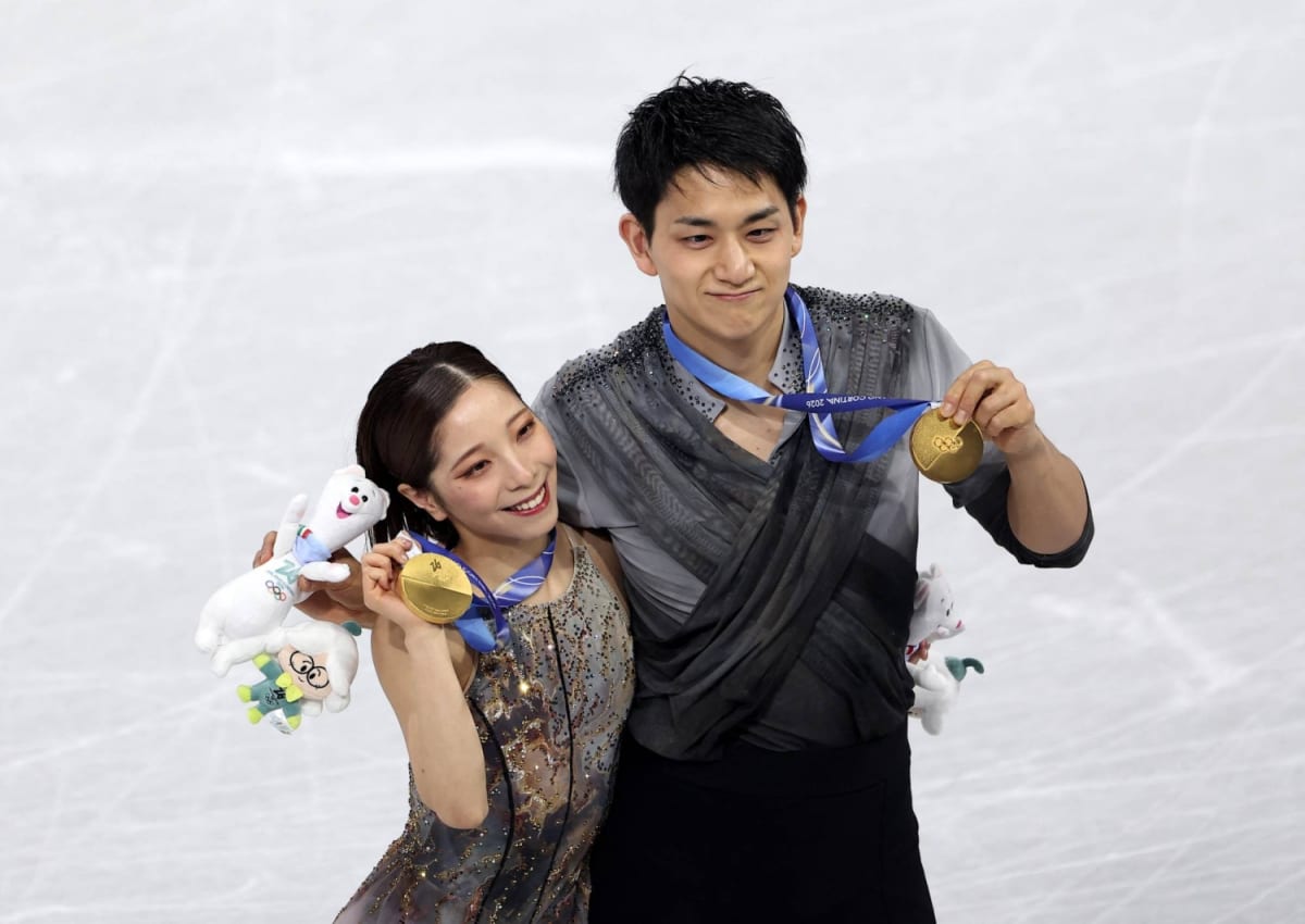 Japanese figure skaters Riku Miura and Ryuichi Kihara performing together on ice
