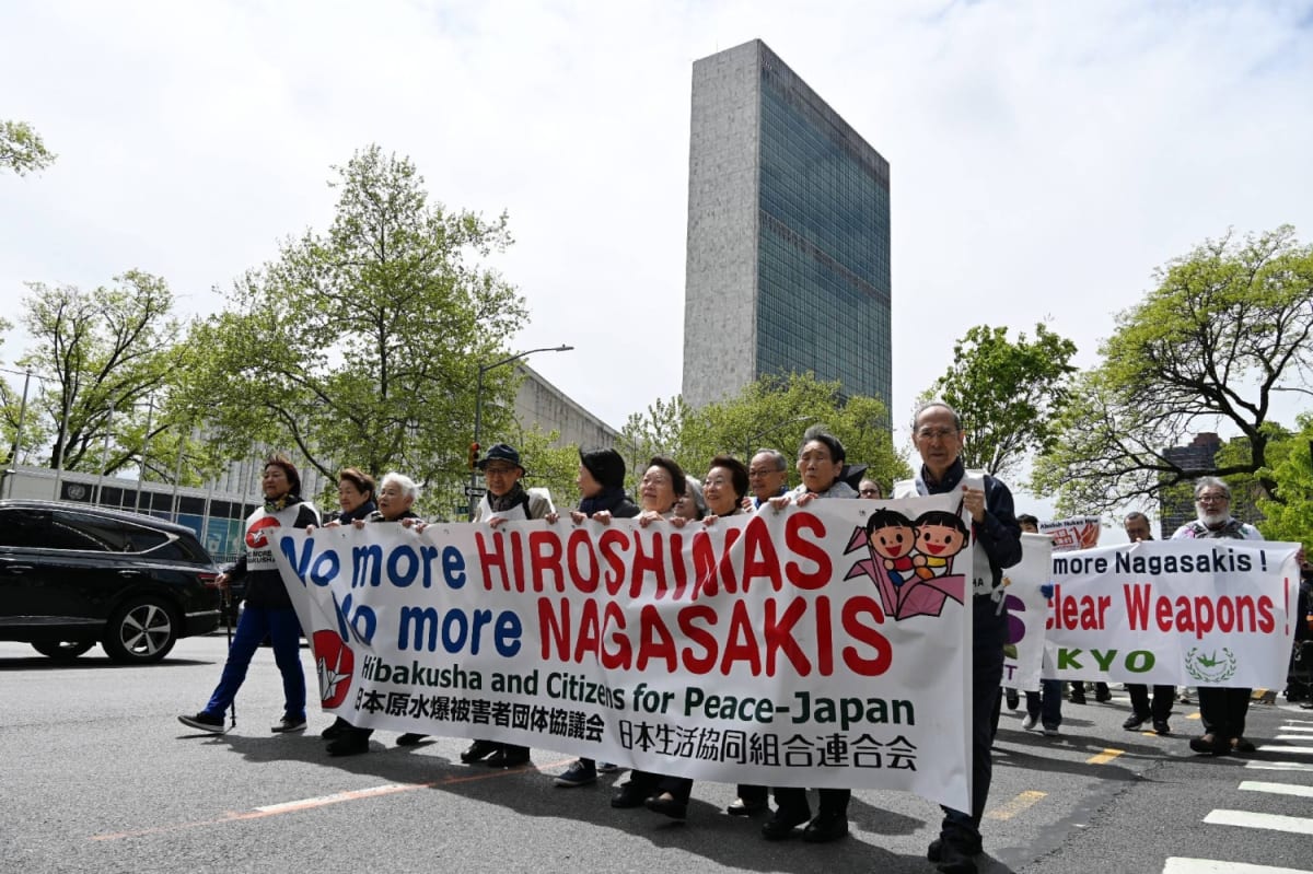 Atomic bomb survivors and young activists marching together toward United Nations headquarters in Manhattan