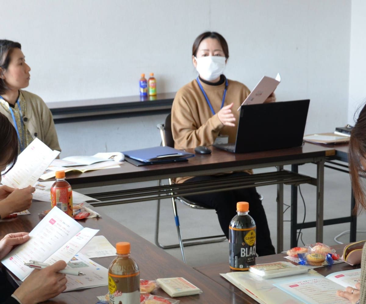 Japanese foster parent welcoming child into warm family home in Fukuoka