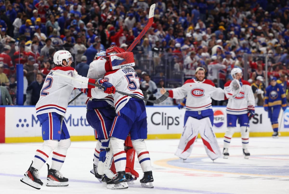 Alex Newhook celebrating overtime goal in Montreal Canadiens uniform during playoff game