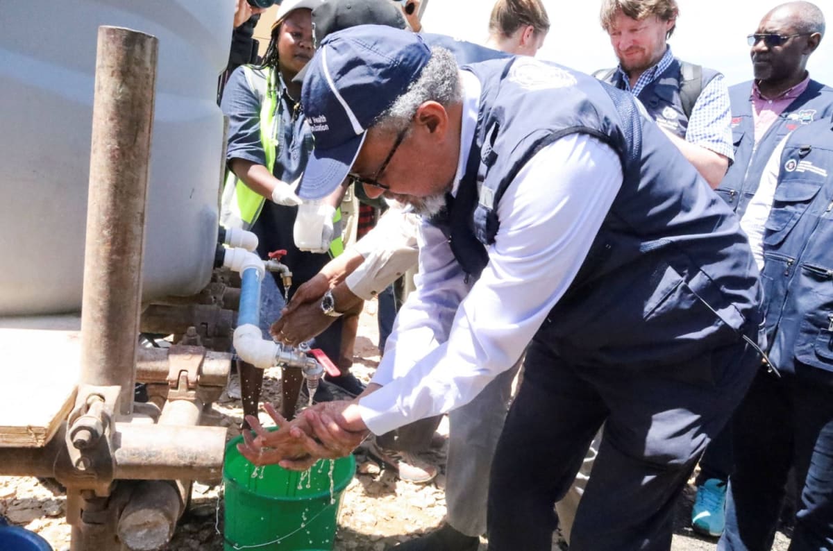 WHO health workers providing medical care and community outreach in Congo during Ebola response effort