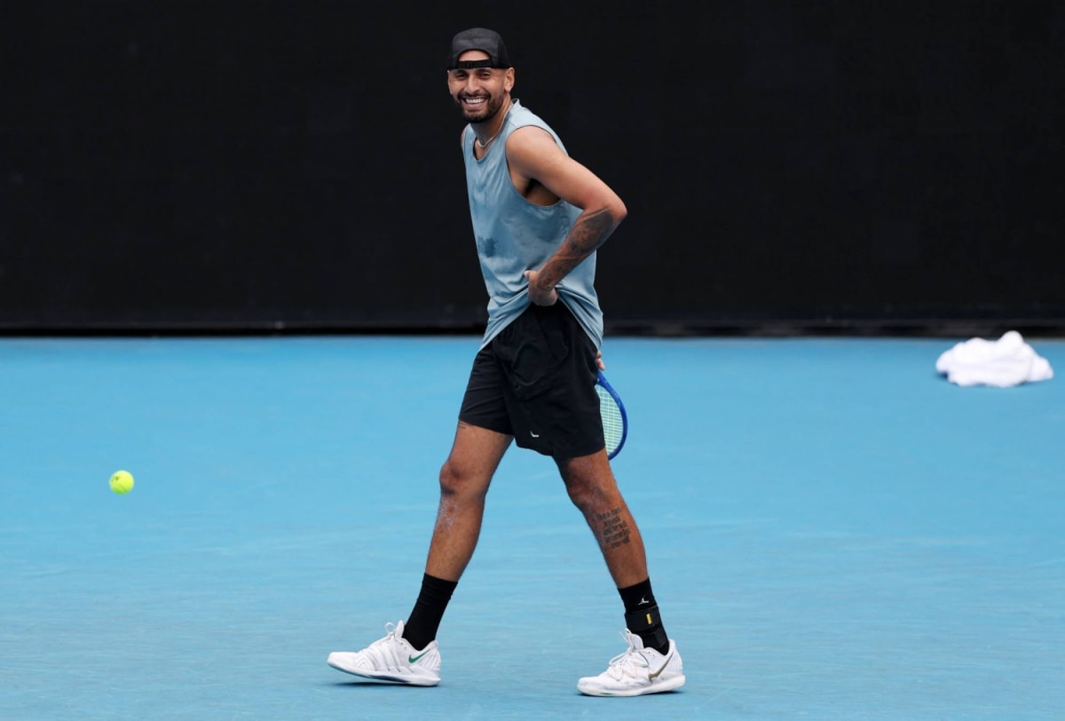Tennis player Nick Kyrgios celebrating on grass court after winning match in Stuttgart