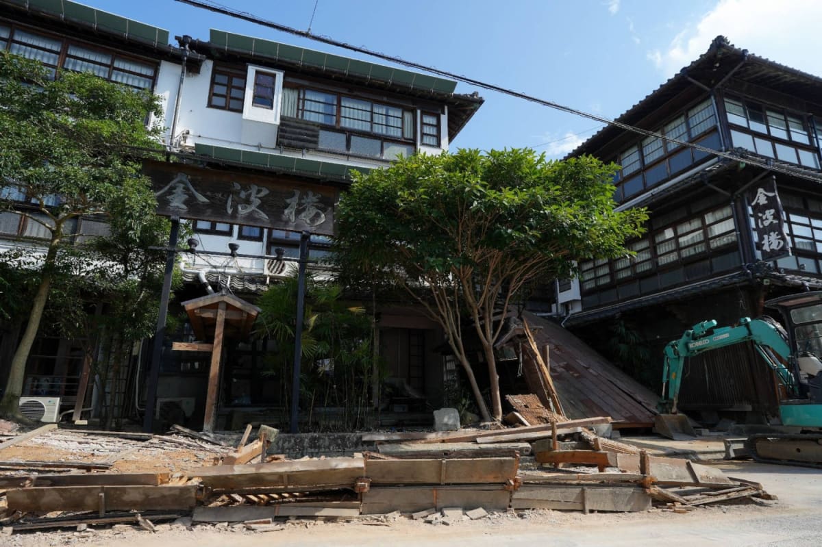 Traditional Japanese ryokan inn with historic wooden architecture in Kumamoto Prefecture hot spring resort