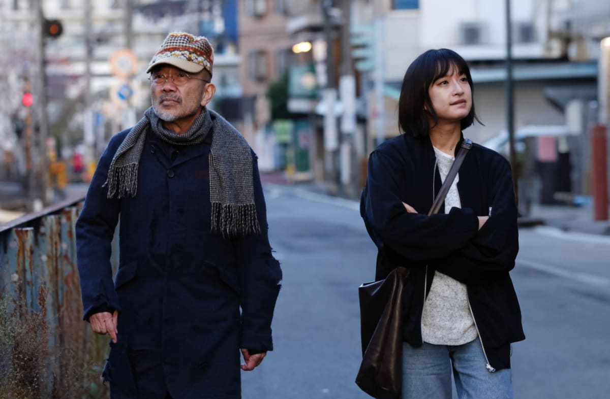 Scene from Ghost of Ueno film showing friendship between social worker and homeless man in Tokyo