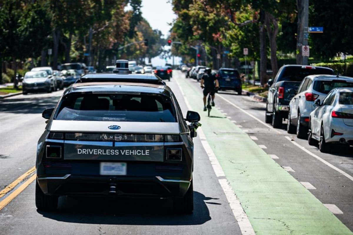 Hyundai IONIQ 5 electric vehicle configured as autonomous robotaxi on city street
