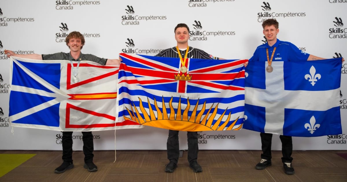 Emily Frick and Vladyslav Usach holding medals at Skills Canada National Competition podium