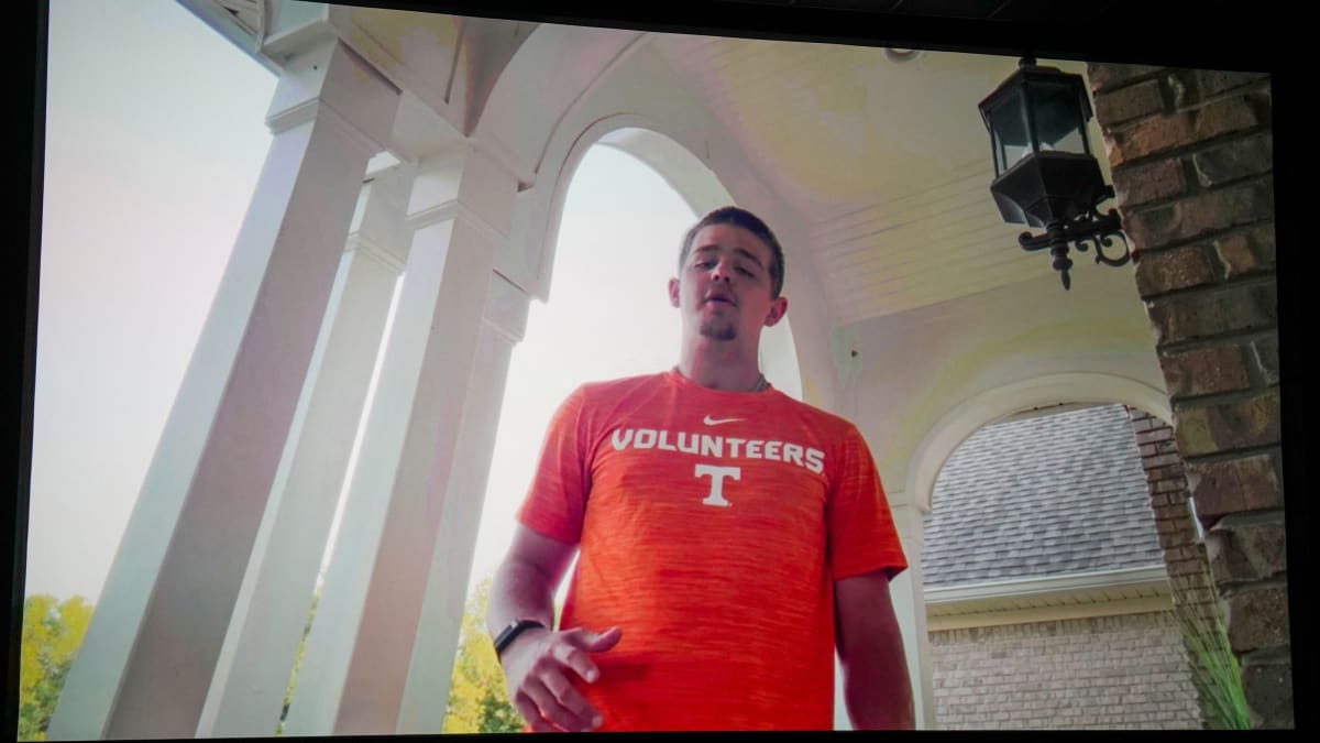 Grayson Pope wearing Tennessee baseball shirt smiling at camera after recovering from brain injury